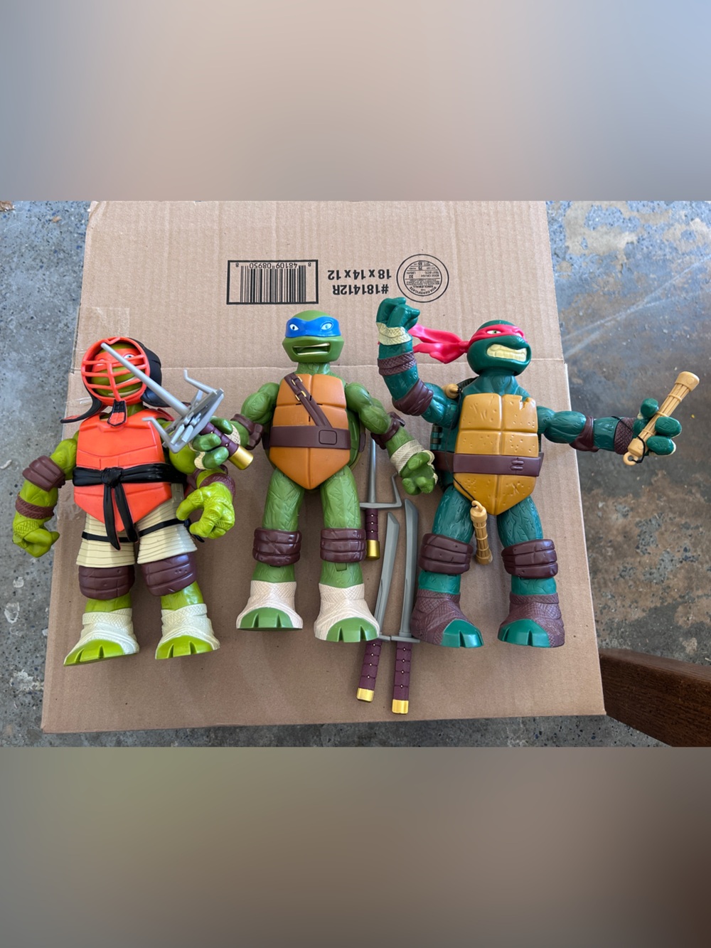 TMNT three 9” turtle figurines with extra swords and throwing stars